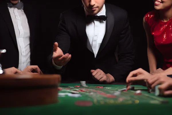 A glowing roulette wheel with cascading chips, symbolizing the engaging live and instant-win games available on A177.